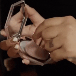 A gif of a makeup artist applying the product