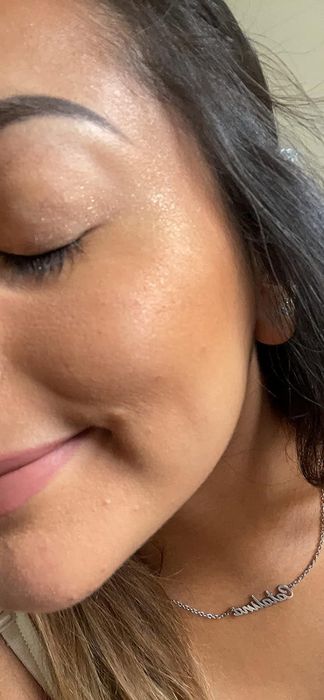 A reviewer with some of the powder on their cheekbones