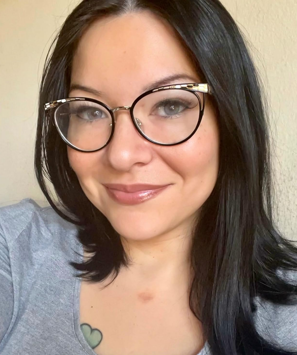 A reviewer wearing the praline shade of lip gloss.