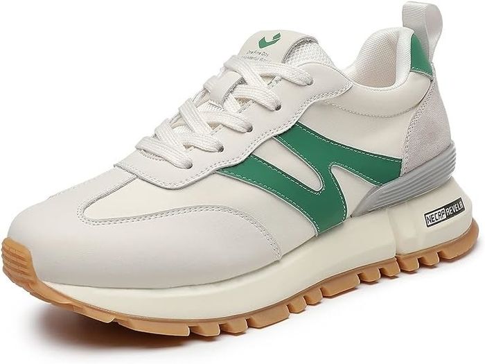 White and green sneakers with a gum rubber sole
