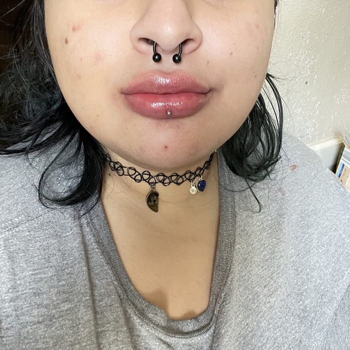 The same reviewer after the tinted lip butter has been applied