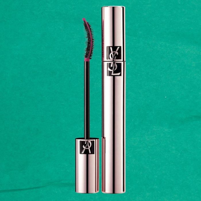 YSL mascara tube and wand with a curved brush, set against a plain background.
