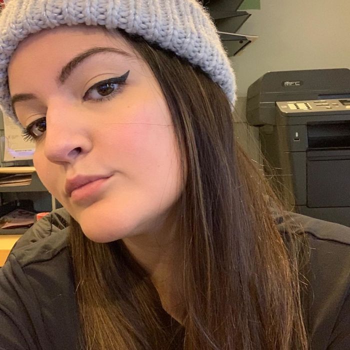 A reviewer shows off their winged liner after using the stamp.