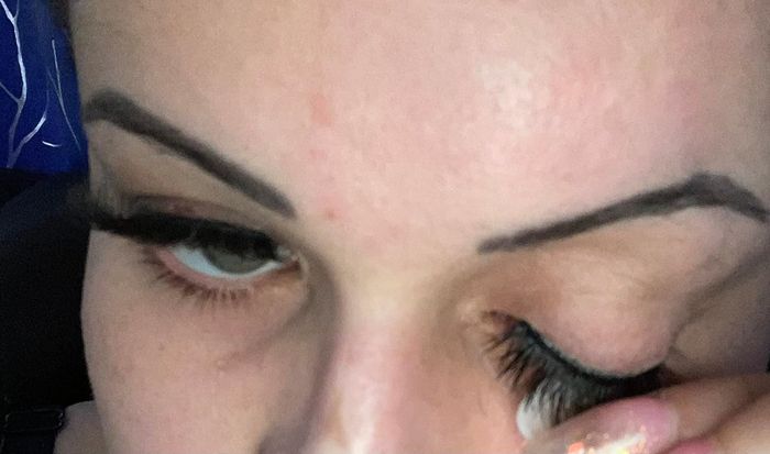 A reviewer trying to remove an eyelash.