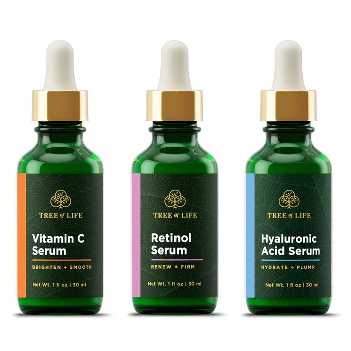 A set of three serums neatly displayed.