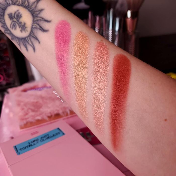 A model showcasing the four shades on their arm.