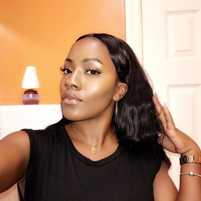 Another reviewer showcasing the highlighter for a glowing look