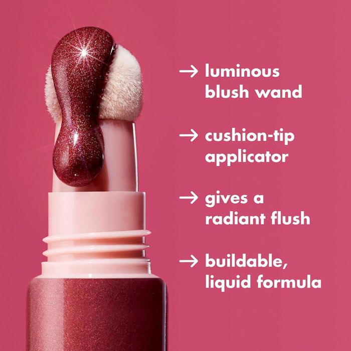 Close-up of a luminous blush wand with a cushion-tip applicator, offering a radiant flush with its buildable liquid formula. Text highlights key features