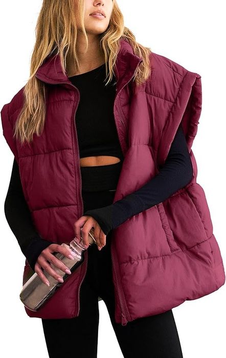 Model wearing a purple vest.
