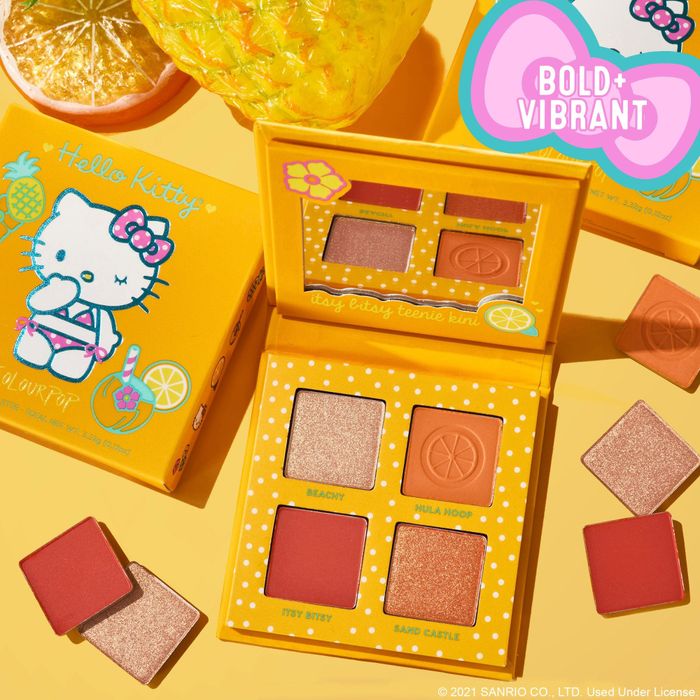 An orange palette featuring Hello Kitty in a bikini and four vibrant eyeshadow shades.