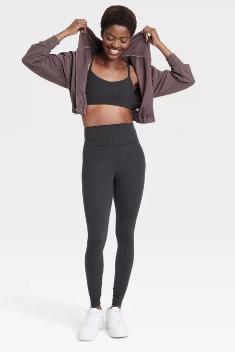 A model wearing high-rise leggings, showcasing a sleek and stylish look.