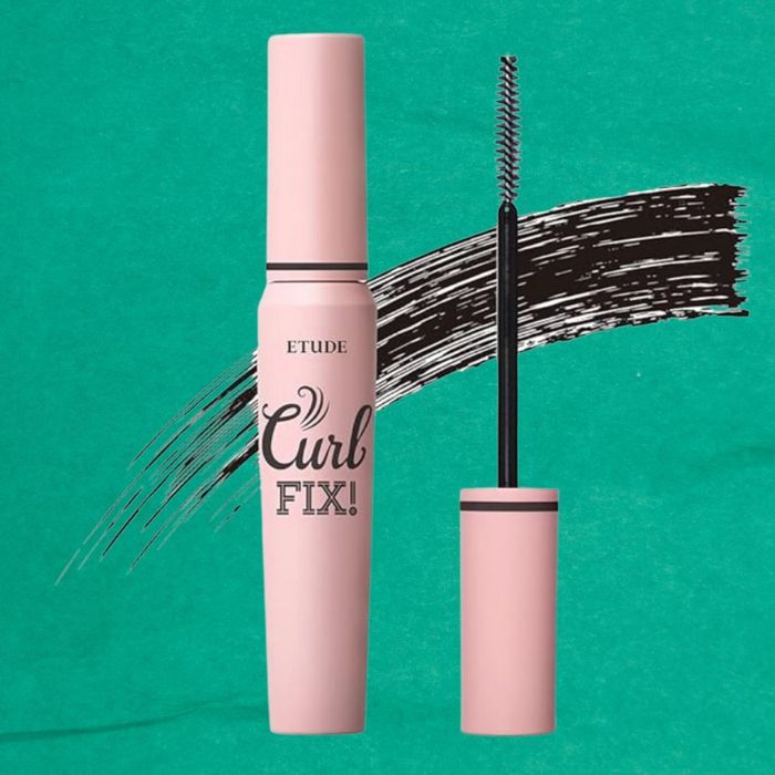 Etude Curl Fix mascara tube and wand with a stroke of mascara behind them.