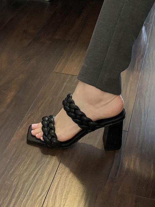 Reviewer wearing black heels