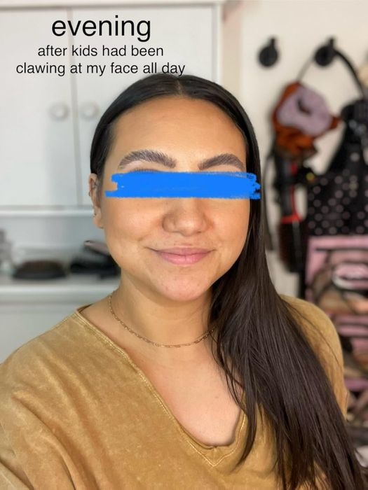 Another reviewer smiling and showing off their makeup.