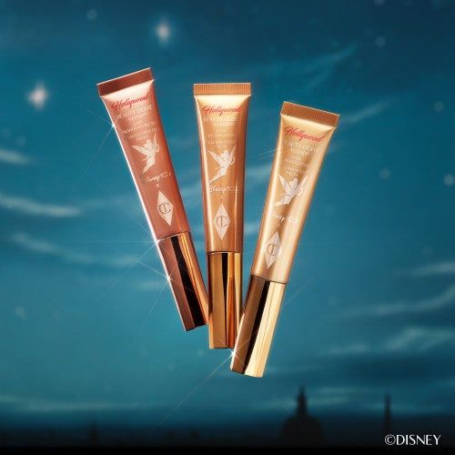 Three Charlotte Tilbury Beauty Light Wands with Tinker Bell adorning each tube