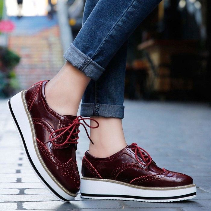 Model wearing red platform shoes