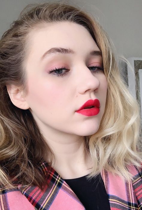 Me with blush applied on both my cheeks and eyelids