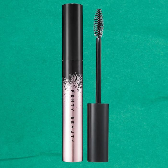 Fenty Beauty mascara with the cap removed, showing the wand applicator next to the tube.