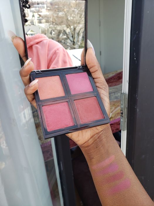 Mytour editor holding the four-shade blush palette.