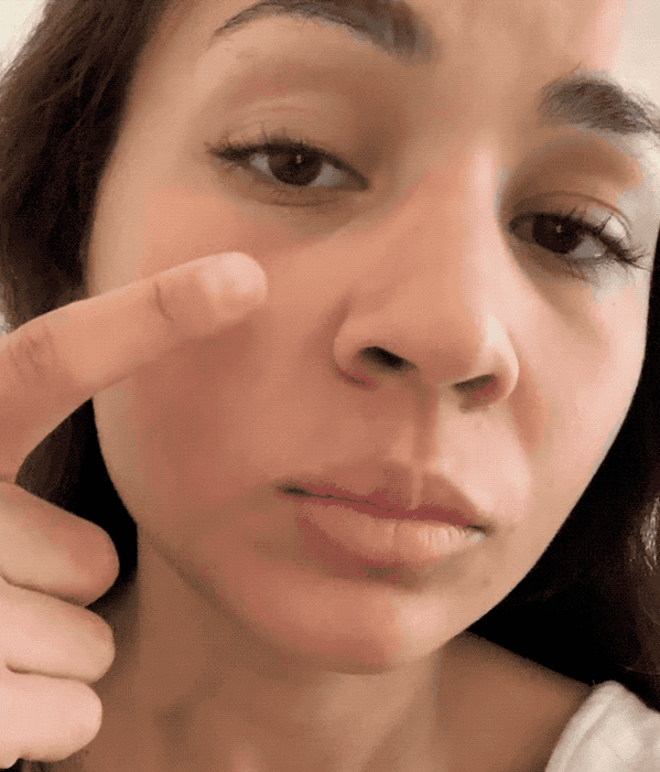 A gif showing a Mytour employee applying Cloud Paint to their cheeks.