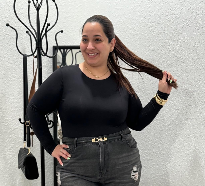 Person showcasing the chic buckle belt.