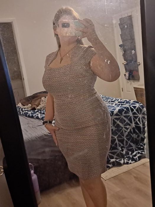 Reviewer wearing the pencil dress