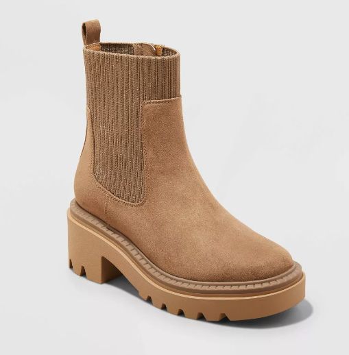 Tan ankle boot with a chunky sole, featuring ribbed elastic panels on the sides for added flexibility