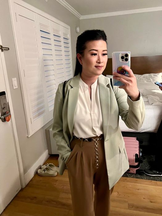 Another reviewer wearing the same blazer in light green