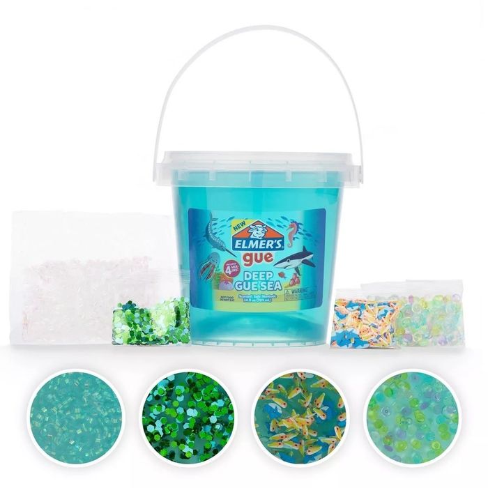 Elmer's Gue Deep GuSea bucket filled with fish-themed slime, complete with mix-ins like green sequins, iridescent beads, blue glitter, and fish-shaped sprinkles.