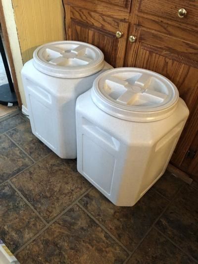 Two 50-lb food storage containers stacked neatly together