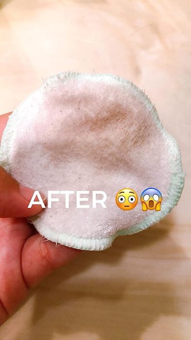 Reviewer after image showing the cotton round now dirty after using the toner on their face