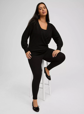 Same model in a black wrap sweater