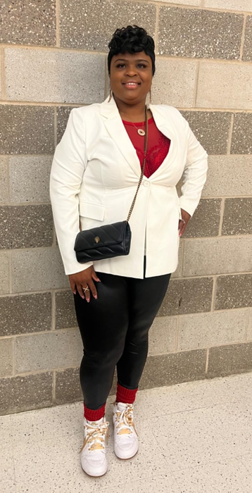 Reviewer wearing the white blazer