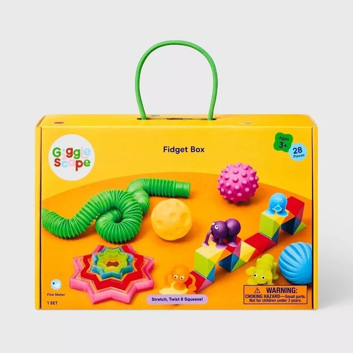 The Giggle Scope Fidget Box, for ages 3 and up, includes 28 fun items such as textured balls, a stretchy tube, and colorful blocks. Note: Contains small parts, posing a choking hazard.