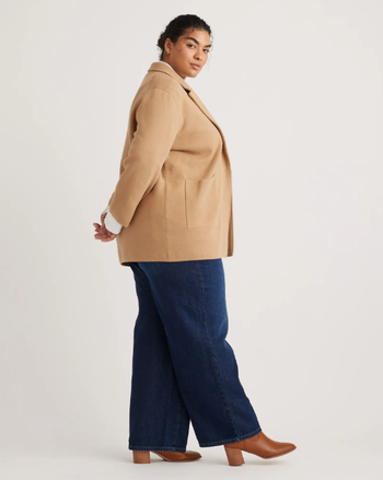 Another model in a camel-colored cotton knit blazer