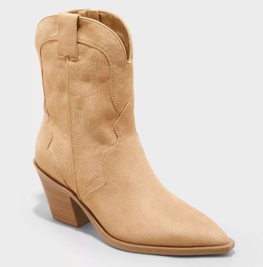 Tan cowboy ankle boots with a pointed toe and a sturdy block heel, perfect for a chic western-inspired look