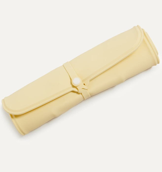 The yellow mat neatly rolled up for storage