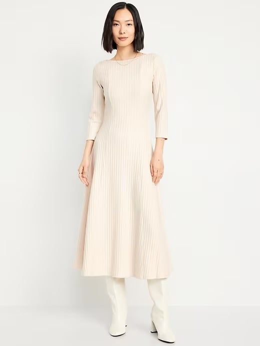 Model dressed in the classic white ribbed maxi dress, exuding effortless chic.