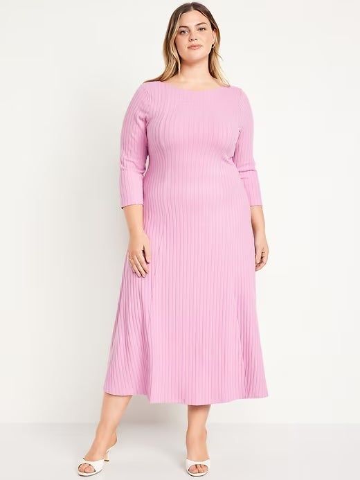 Model showcasing a pink ribbed dress, perfect for a relaxed yet stylish look.