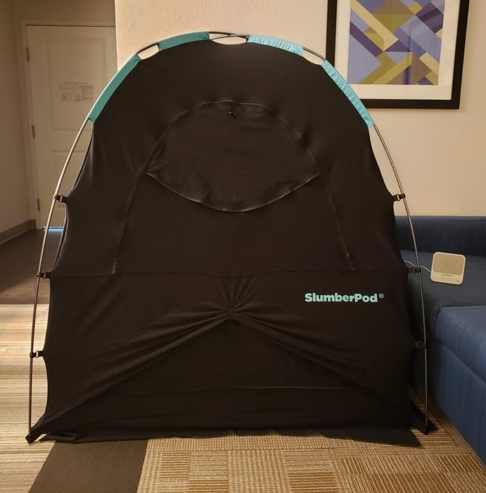 A photo from a reviewer showing the SlumberPod set up with the front zip door securely closed