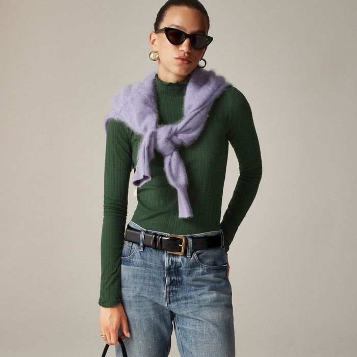 A model wearing a green turtleneck