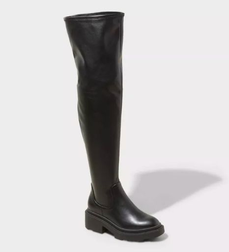 Trendy over-the-knee black leather boots with a chunky sole