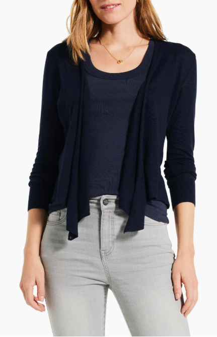 Person dressed casually in a navy cardigan.