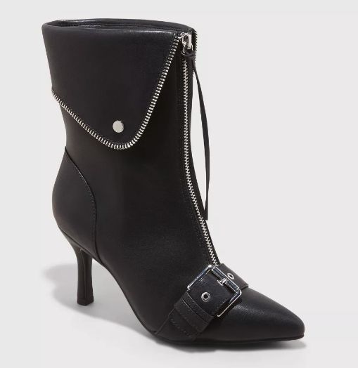 A high-heeled ankle boot with a zipper closure in front, a fold-over flap, and a chic buckle detail