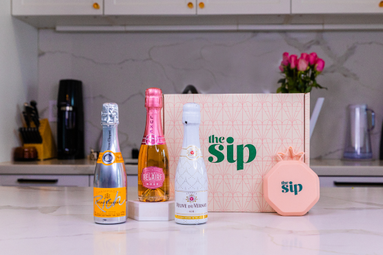 The three bottles of sparkling wine neatly arranged in the box