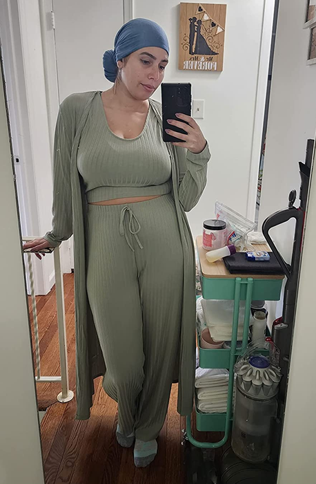 A reviewer showcasing the light green ribbed tank, pants, and cardigan set