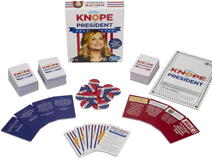 The game, featuring cards and vote button tokens
