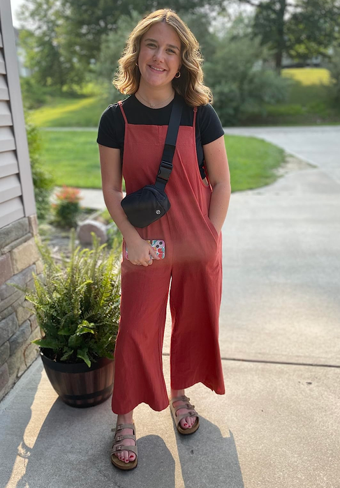 Another reviewer rocking rust-colored overalls