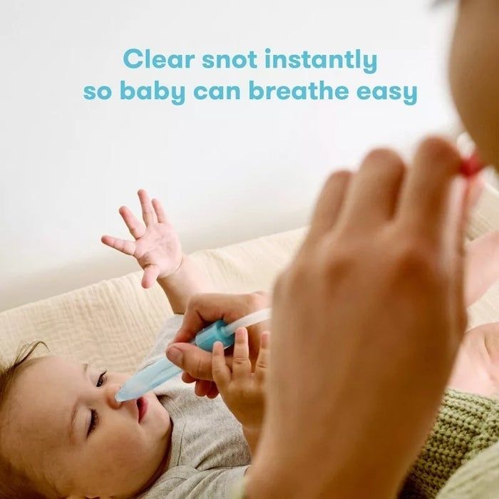A parent using a nasal aspirator to clear their baby’s nose. Text: 