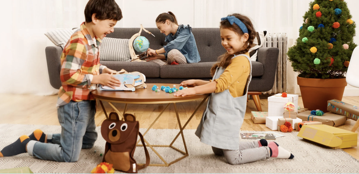Three kids playing with two different crate kits